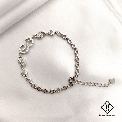 Elegant Infinity Knot Bracelet with Sparkling CZ Accents – Laxmi Jewellers