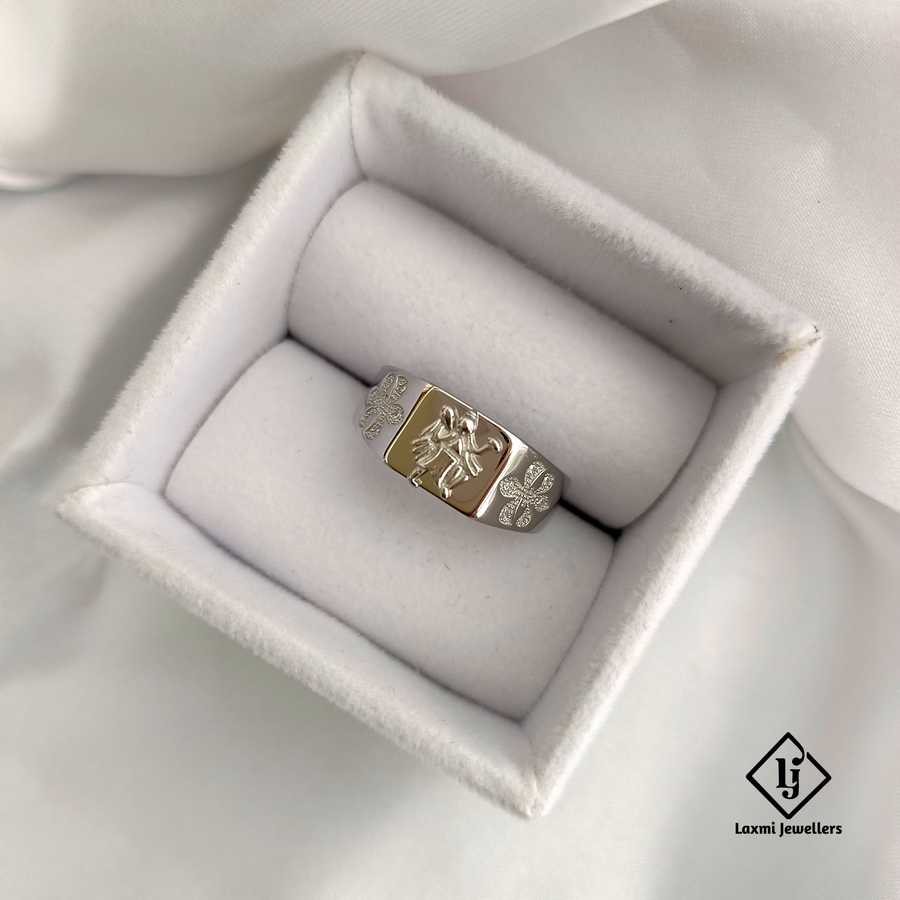 A 925 silver ring with a Hanumanji design, presented in a white box lined with a plush white fabric.