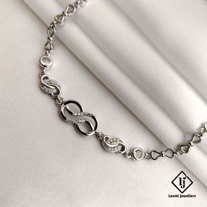 Elegant Infinity Knot Bracelet with Sparkling CZ Accents – Laxmi Jewellers
