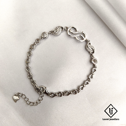 Elegant Infinity Knot Bracelet with Sparkling CZ Accents – Laxmi Jewellers